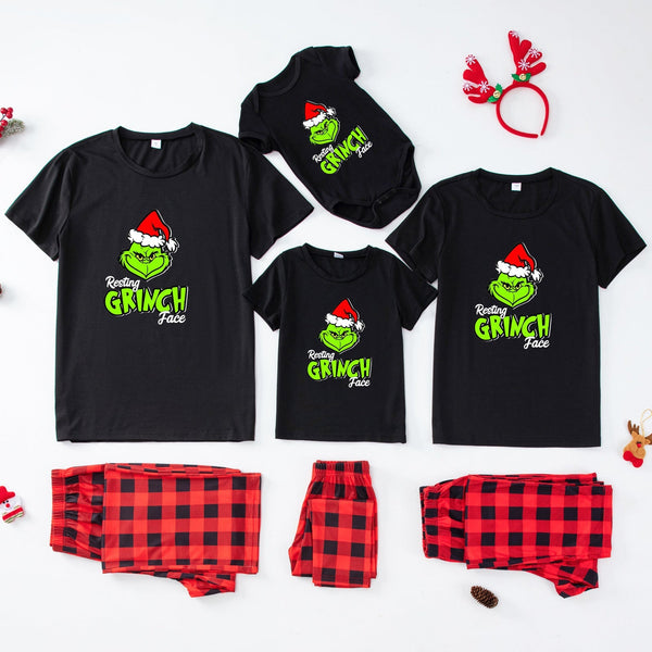 Family matching pajamas with Santa & Grinch print